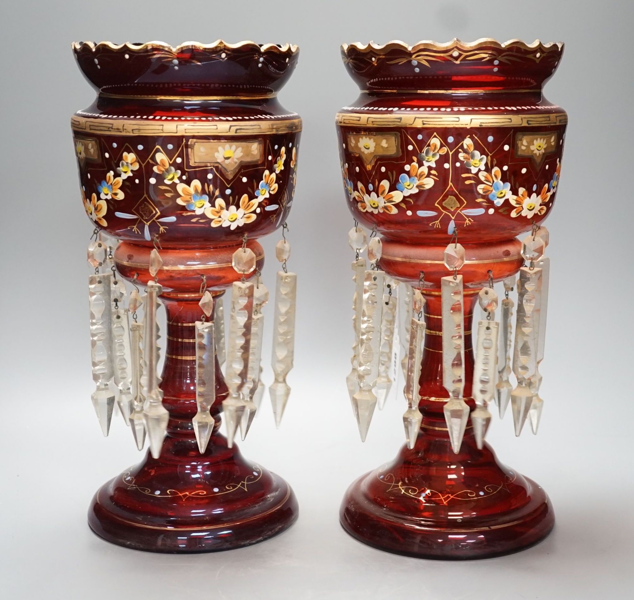 A pair of late 19th century ruby glass and enamel lustres - 36cm high